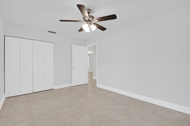 unfurnished bedroom featuring a closet and ceiling fan