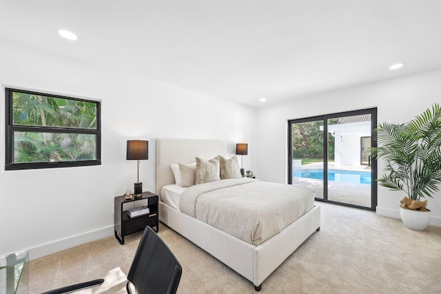 carpeted bedroom featuring access to exterior