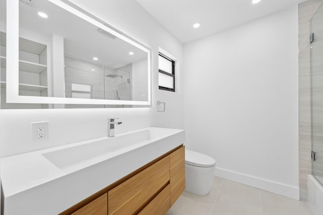 bathroom with vanity, tile patterned floors, and toilet