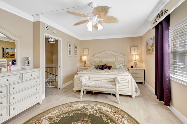 bedroom with crown molding, light hardwood / wood-style floors, and ceiling fan