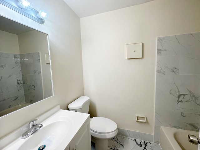 full bathroom with vanity, tiled shower / bath, and toilet