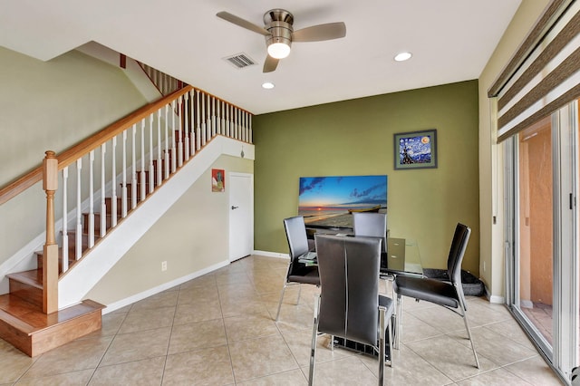 interior space with light tile patterned flooring and ceiling fan