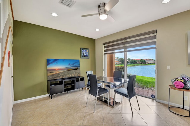 tiled dining room with ceiling fan