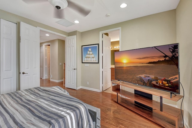 bedroom featuring wood-type flooring and ceiling fan