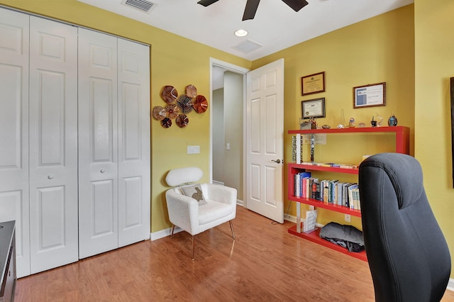 office space with hardwood / wood-style flooring and ceiling fan