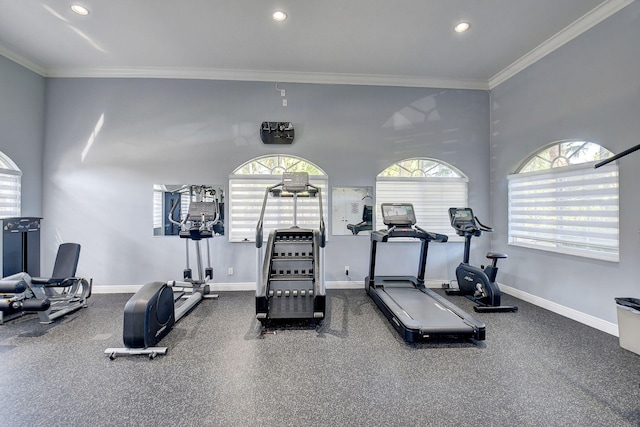 workout area featuring ornamental molding