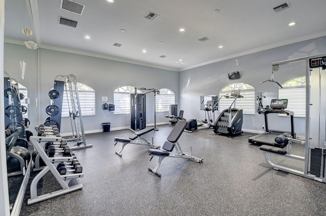 workout area featuring ornamental molding