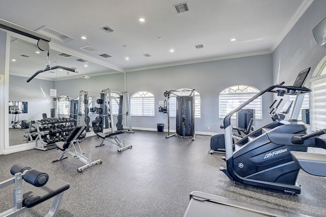 exercise room featuring crown molding