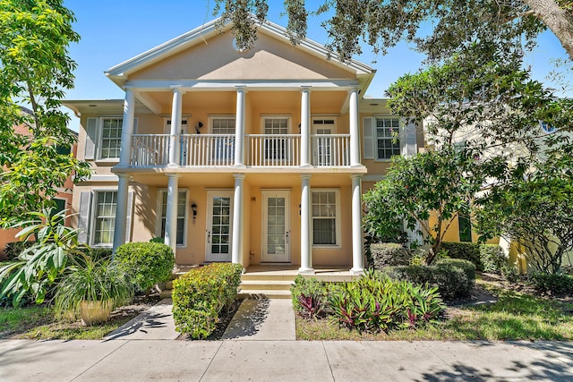 greek revival house featuring a balcony