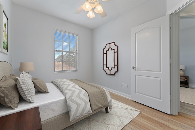 bedroom featuring ceiling fan and light wood-type flooring