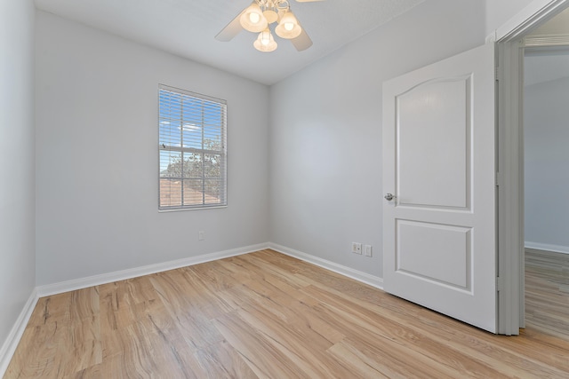 unfurnished room with ceiling fan and light wood-type flooring