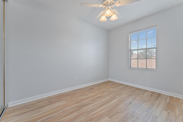 unfurnished room with ceiling fan and light wood-type flooring