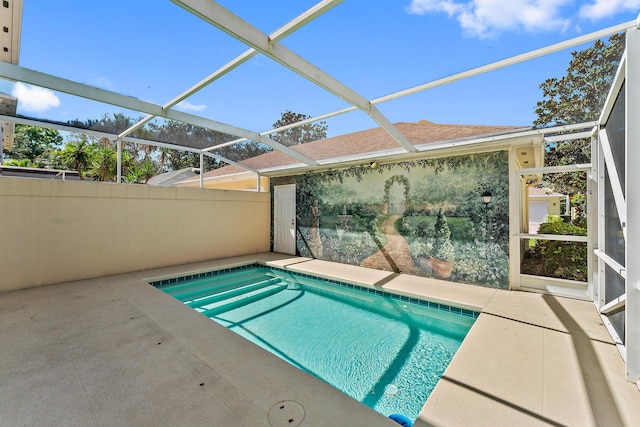 view of pool featuring a lanai