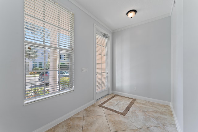 doorway to outside featuring light tile patterned floors, crown molding, and plenty of natural light