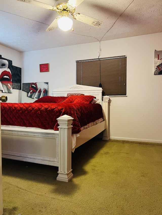 bedroom with a textured ceiling, carpet floors, and ceiling fan