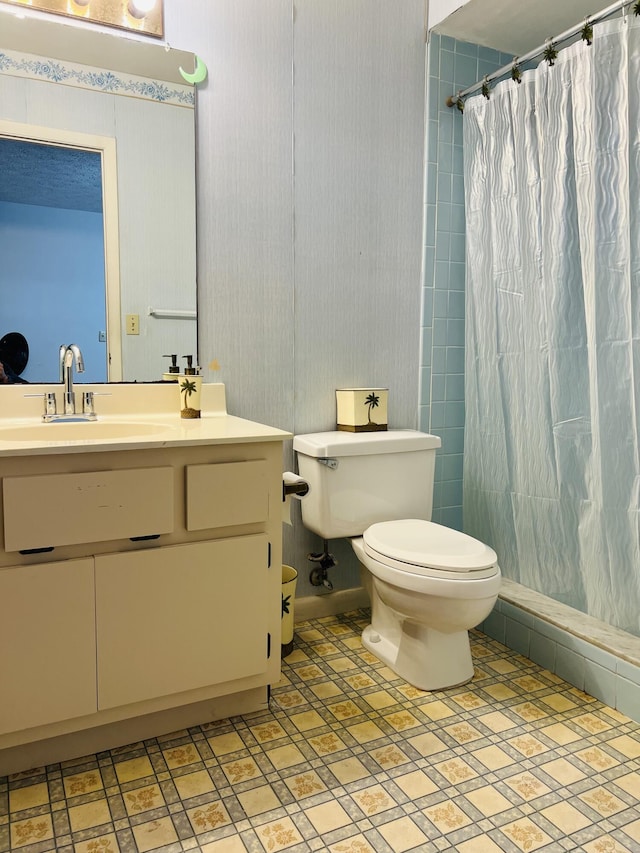 bathroom featuring vanity, a shower with curtain, and toilet