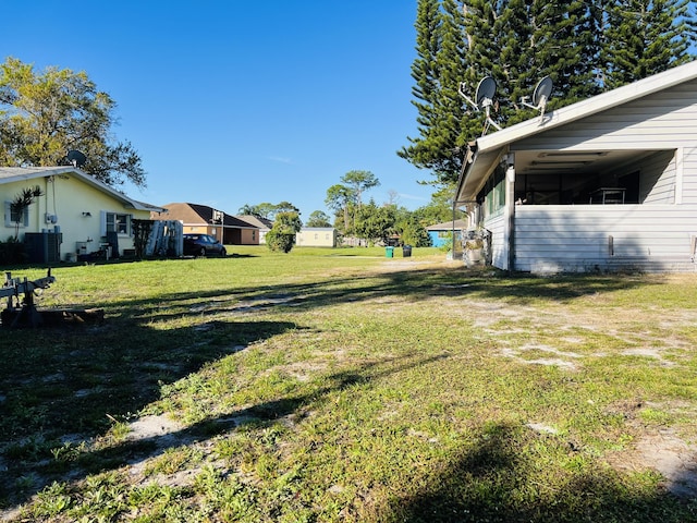 view of yard featuring central air condition unit