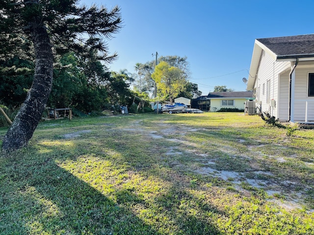 view of yard with central AC