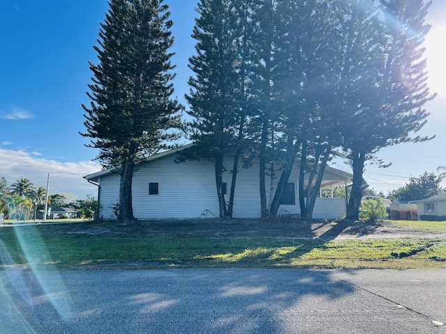 view of home's exterior featuring a lawn