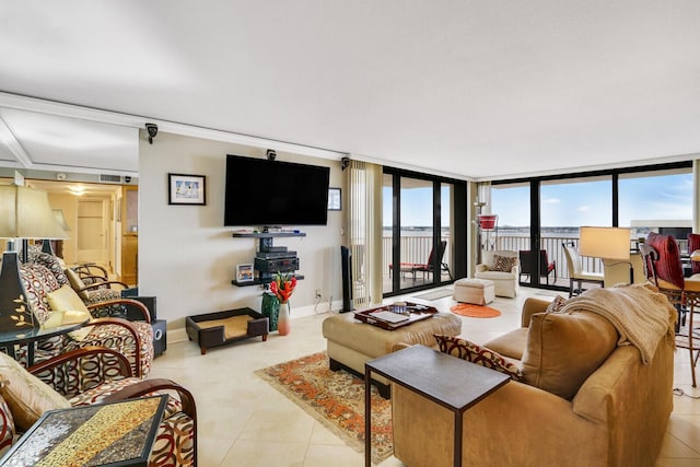 living room with light tile patterned floors and floor to ceiling windows