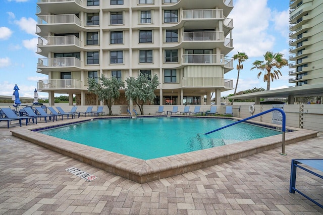 view of swimming pool with a patio area