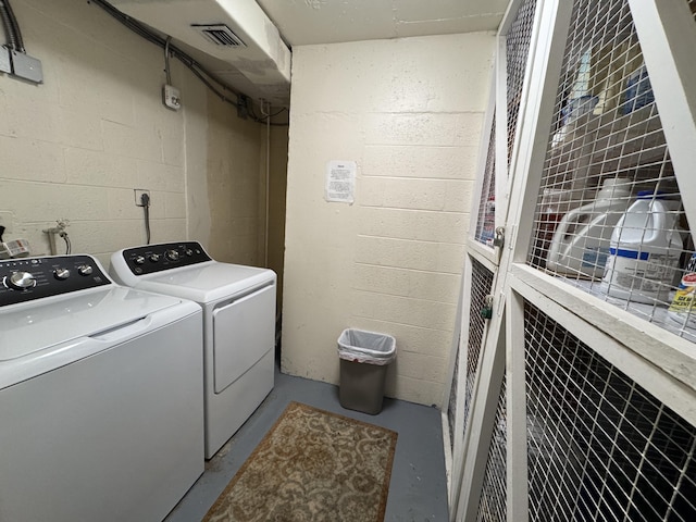 washroom featuring washer and clothes dryer