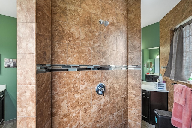 bathroom featuring vanity and a shower