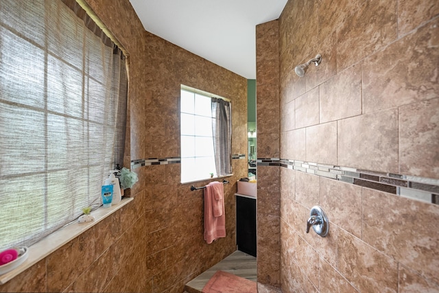 bathroom with a tile shower