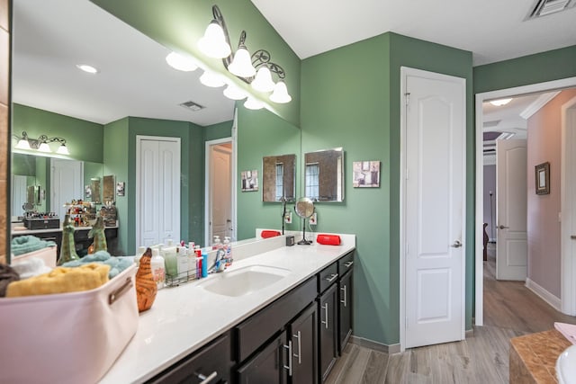 bathroom featuring vanity and wood-type flooring