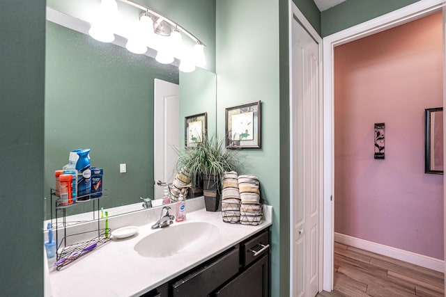 bathroom featuring vanity and wood-type flooring