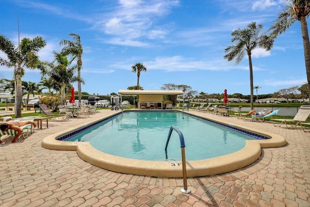 view of swimming pool with a patio area