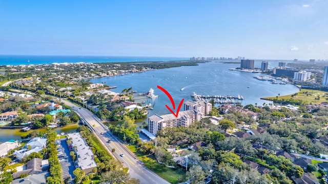 birds eye view of property featuring a water view