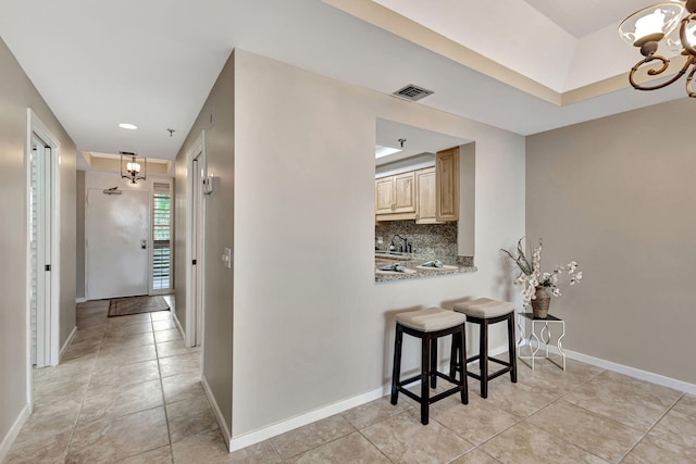 11370 Twelve Oaks Way Unit 217, North Palm Beach, FL 33408 - corridor featuring a chandelier, light tile patterned floors, baseboards, and recessed lighting
