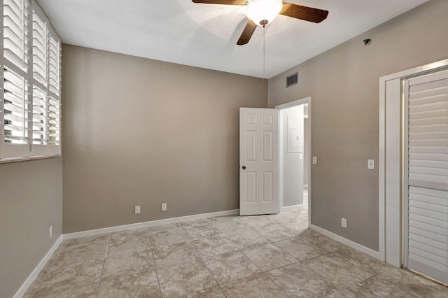 11370 Twelve Oaks Way Unit 217, North Palm Beach, FL 33408 - unfurnished bedroom with a ceiling fan, baseboards, and a closet