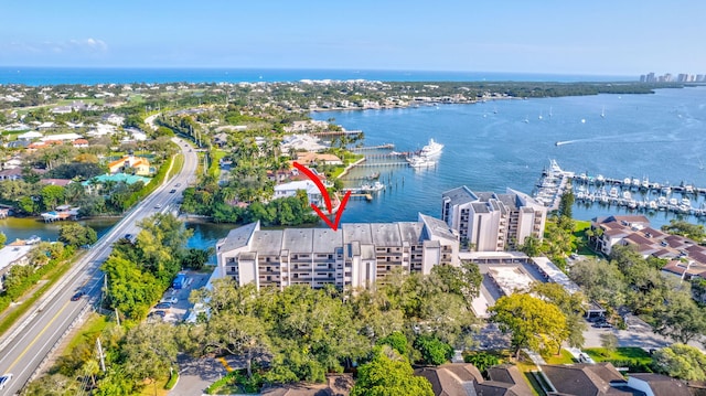 birds eye view of property featuring a water view