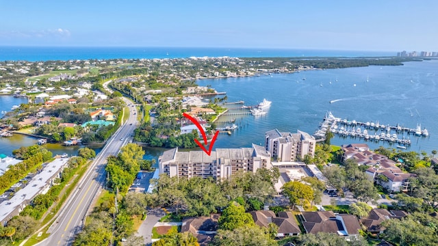 birds eye view of property with a water view