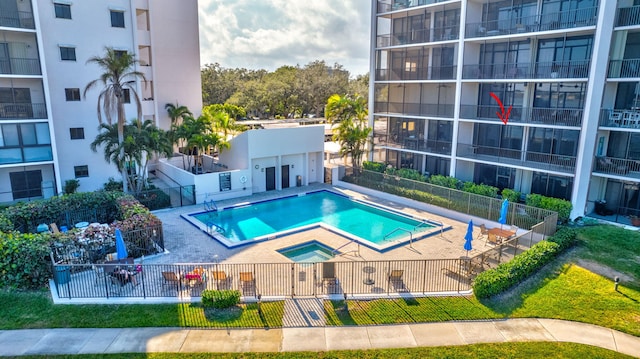 11370 Twelve Oaks Way Unit 217, North Palm Beach, FL 33408 - community pool with fence and a patio