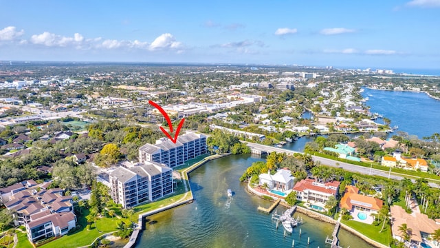 birds eye view of property with a water view