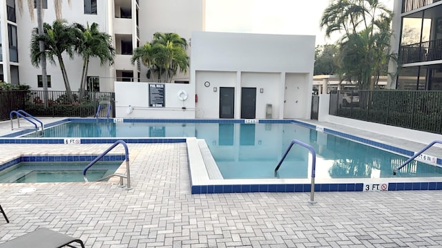 view of pool featuring a hot tub