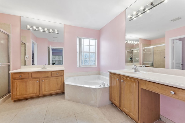 bathroom featuring tile patterned floors, vanity, and plus walk in shower