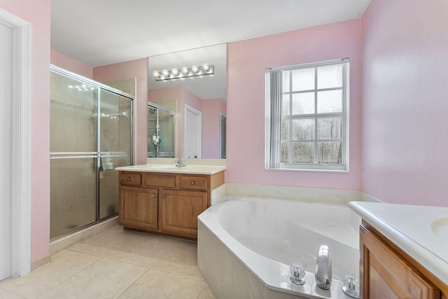 bathroom with tile patterned floors, vanity, and plus walk in shower