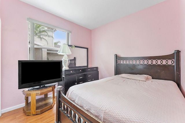 bedroom featuring hardwood / wood-style flooring