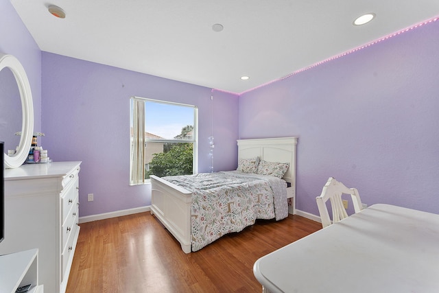 bedroom with hardwood / wood-style flooring