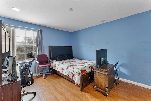 bedroom featuring light hardwood / wood-style flooring