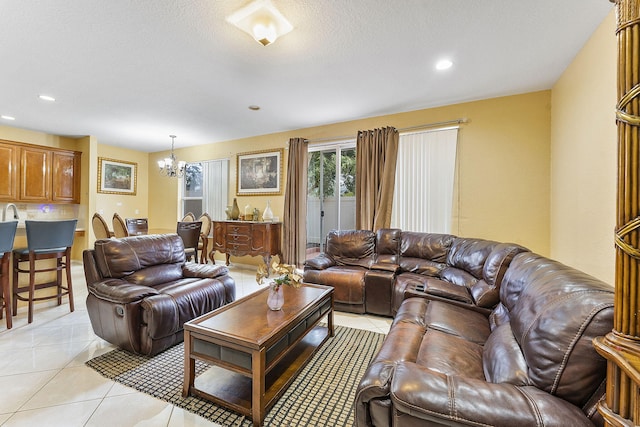 living room featuring a chandelier and light tile patterned floors