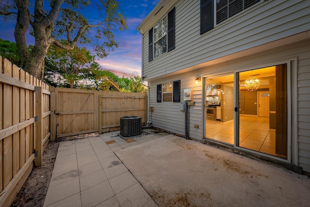 patio terrace at dusk with central AC unit