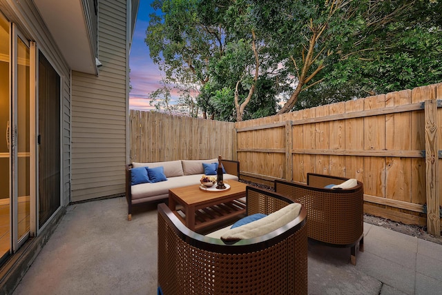 patio terrace at dusk with outdoor lounge area