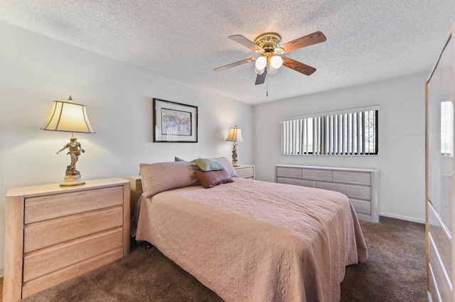 carpeted bedroom featuring ceiling fan and a textured ceiling