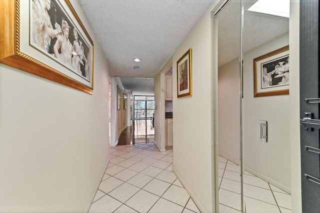 hallway with light tile patterned flooring