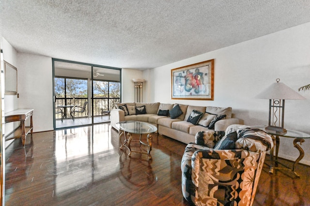 4725 Lucerne Lakes Blvd Unit 410, Lake Worth, FL 33467 - living area featuring wood finished floors, a textured ceiling, and floor to ceiling windows